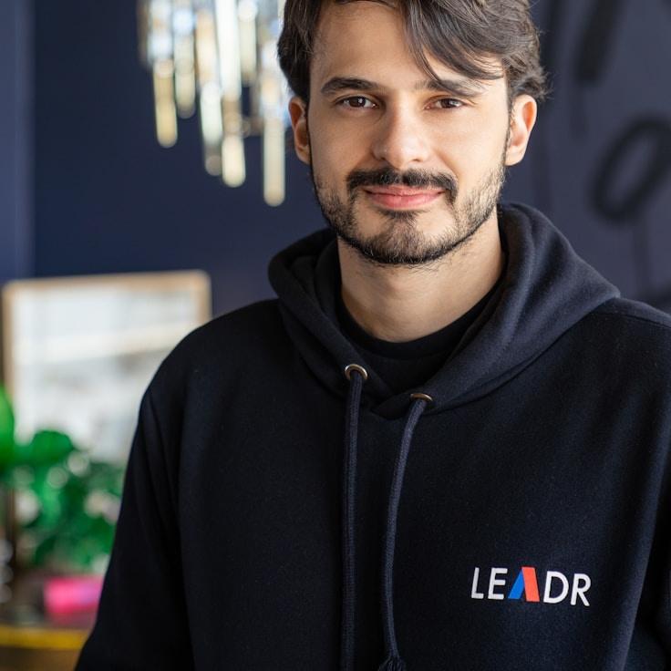 Riley Kapoor, Client Relations Director, discussing corporate gifting strategy with business clients